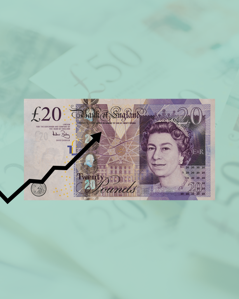 A Bank of England twenty pound note with a rising black arrow across it, on a mint green background of banknotes